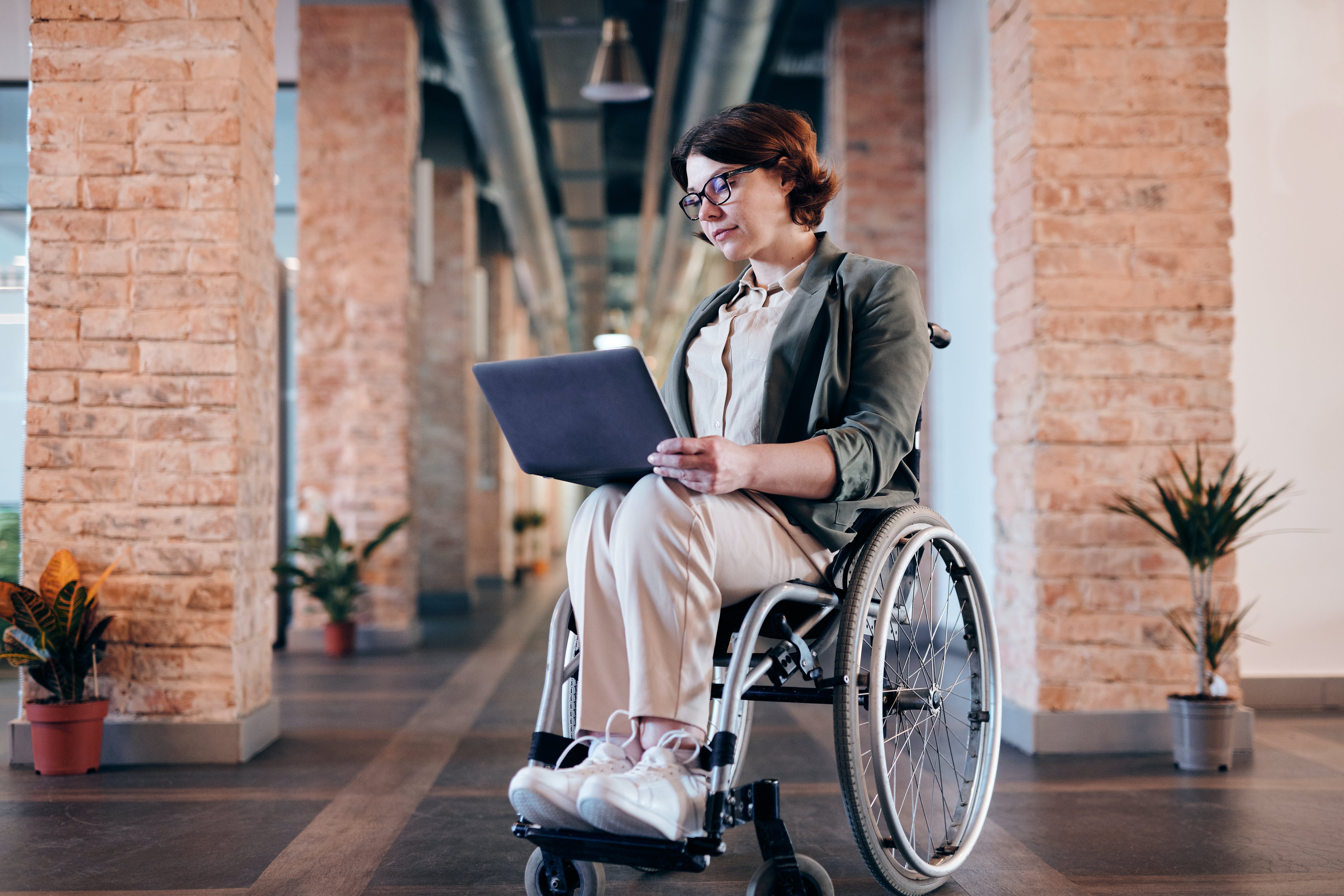 Woman on a computer in a wheel chair